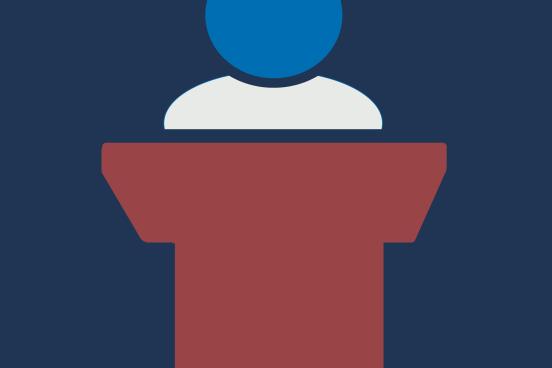 Person standing at a lectern
