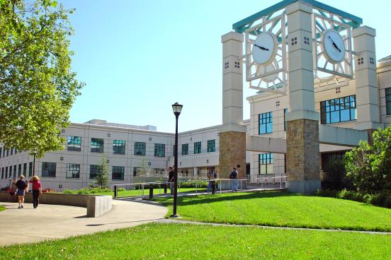 The lawn in front of the clocktower of the Schulz Information Center
